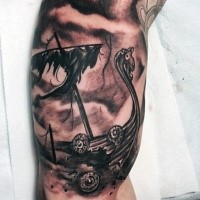 Black and gray style biceps tattoo of corrupted viking ship