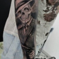 Black and gray style big arm tattoo of mafioso skeleton