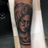 Black and gray style colored forearm tattoo of woman in hood