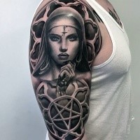 Black and gray style colored shoulder tattoo of demonic woman and star