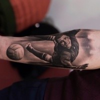 Black and gray style cool looking forearm tattoo of vintage football player