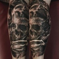 Black and gray style creepy looking leg tattoo of human skull