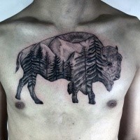 Black and gray style detailed grunting ox tattoo on chest stylized with mountain forest