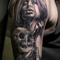 Black and gray style detailed shoulder tattoo of seductive woman with human skull