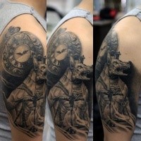 Black and gray style detailed shoulder tattoo of evil Egypt God with clock