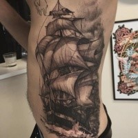 Black and gray style detailed side tattoo of cool sailing ship with waves