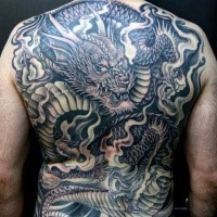 Black and gray style detailed whole back tattoo of creepy dragon with smoke