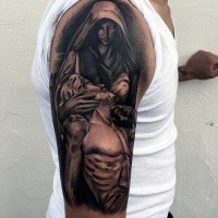 Black and gray style dramatic religious tattoo on shoulder