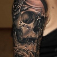 Black and gray style human skull with rose and number