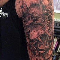 Black and gray style impressive looking shoulder tattoo of evil tiger