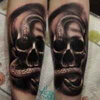Black and gray style medium size forearm tattoo of human skull with octopus