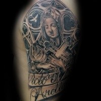 Black and gray style memorial woman with cross and lettering tattoo on shoulder