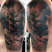 Black and gray style shoulder memorial tattoo of lighthouse and lettering