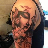 Black and gray style shoulder tattoo of Buddha with lotus flower