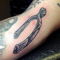 Black and gray style small arm tattoo of bone