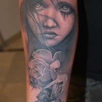 Black and gray style very detailed forearm tattoo fo girl portrait and various insects
