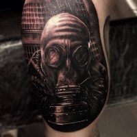 Black and gray style very detailed tattoo of man in gas mask in forest