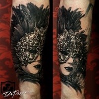 Black and white forearm tattoo of woman in mystic mask