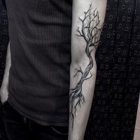 Black and white illustrative style sleeve tattoo of big tree