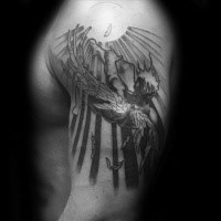 Black and white large shoulder tattoo of burning Icarus