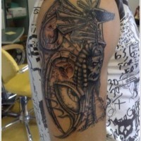 Black anubis tattoo design on shoulder