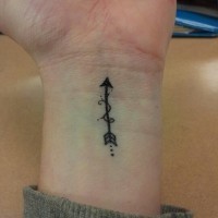 Black arrow tattoo on wrist for boys