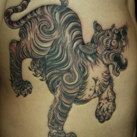 Black asian tiger tattoo on ribs