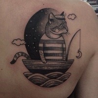Black cat fisherman tattoo on shoulder blade