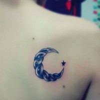 Black crescent moon tattoo on back