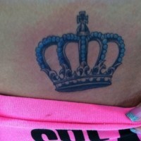 Black crown with blue pearls tattoo