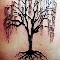 Black dead tree with roots tattoo