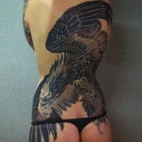 Black flying eagle tattoo on whole back for women