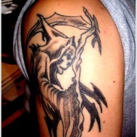 Black gray grim reaper tattoo on shoulder