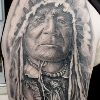 Black gray old indian tattoo on shoulder by Matthew James