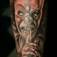 Black gray scary clown face tattoo