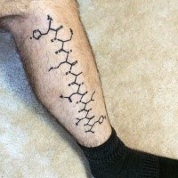 Black ink amazing looking colored leg tattoo of chemistry formula
