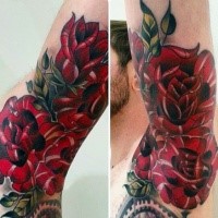 Black ink arm tattoo of large red roses with leaves