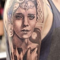 Black ink awesome looking shoulder tattoo of beautiful woman