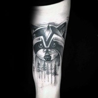 Black ink beautiful looking arm tattoo of raccoon face with forest