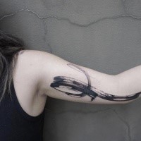 Black ink biceps tattoo of simple ornament