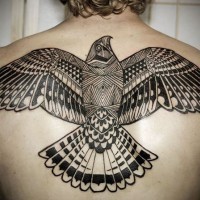 Black ink bird tattoo on upper back