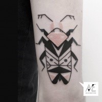 Black ink detailed arm tattoo of big bug