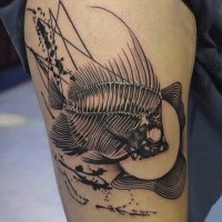 Black ink detailed thigh tattoo of big fish skeleton
