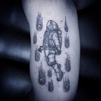 Black ink dot style arm tattoo of astronaut with asteroids