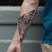 Black ink dot style Valentin Hirsch painted forearm tattoo of tiger face in triangle