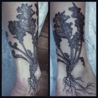 Black ink engraving style ankle tattoo of small plant