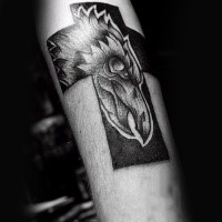 Black ink engraving style arm tattoo of cross with big phoenix bird