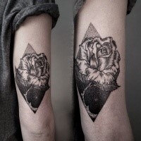 Black ink engraving style arm tattoo of rose with rhombus