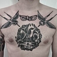 Black ink engraving style chest tattoo of flying birds with knot and human heart