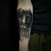 Black ink forearm tattoo of old woman and dark forest